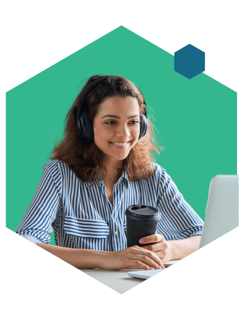 Person with laptop, coffee and headset smiling