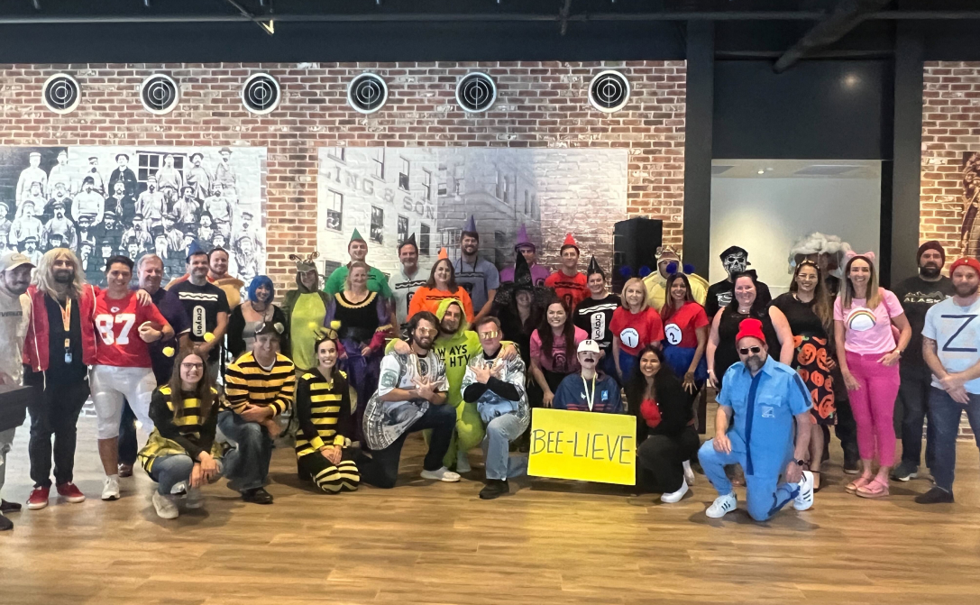 Group photo of Docubee team at a Halloween party